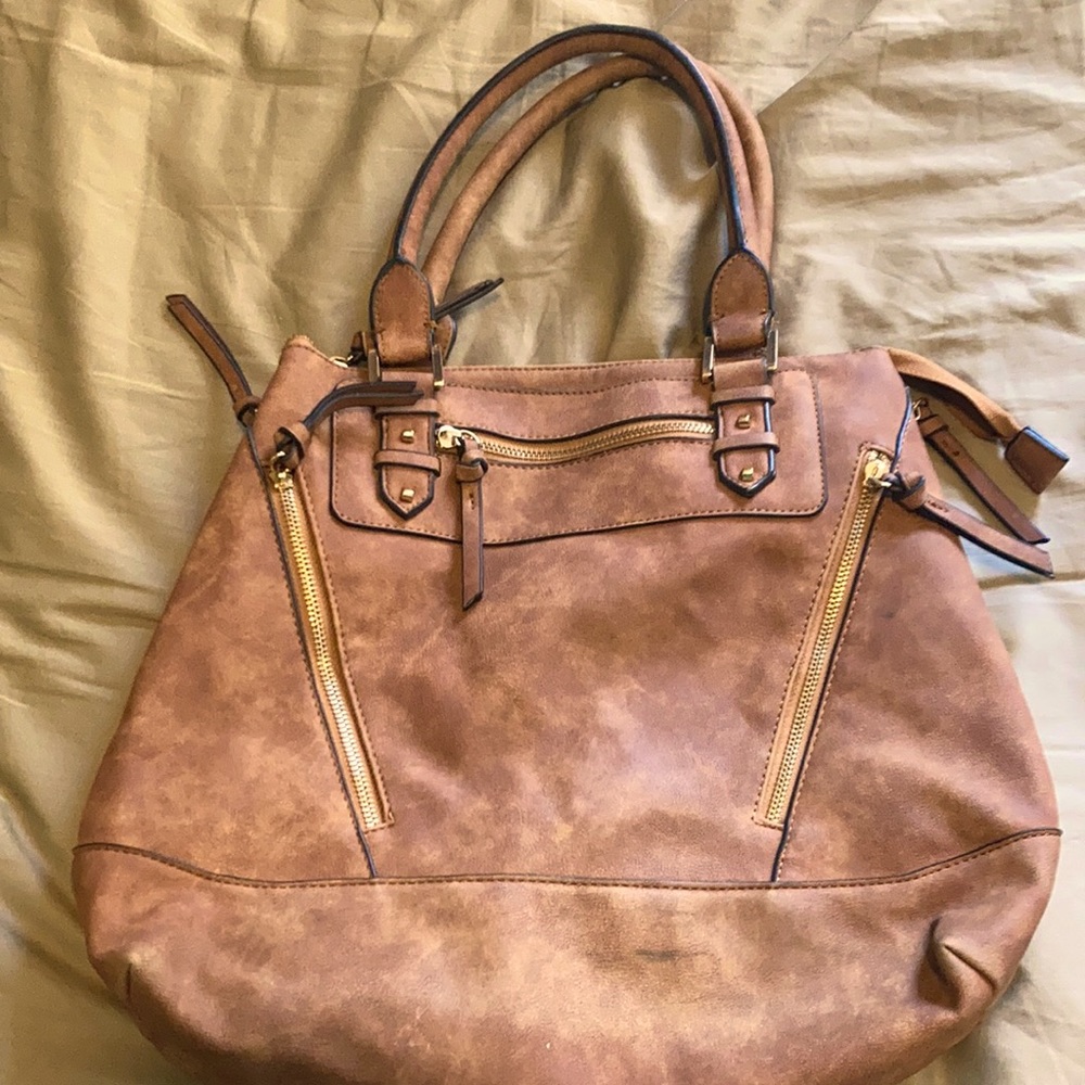 A big and beautiful brown purse